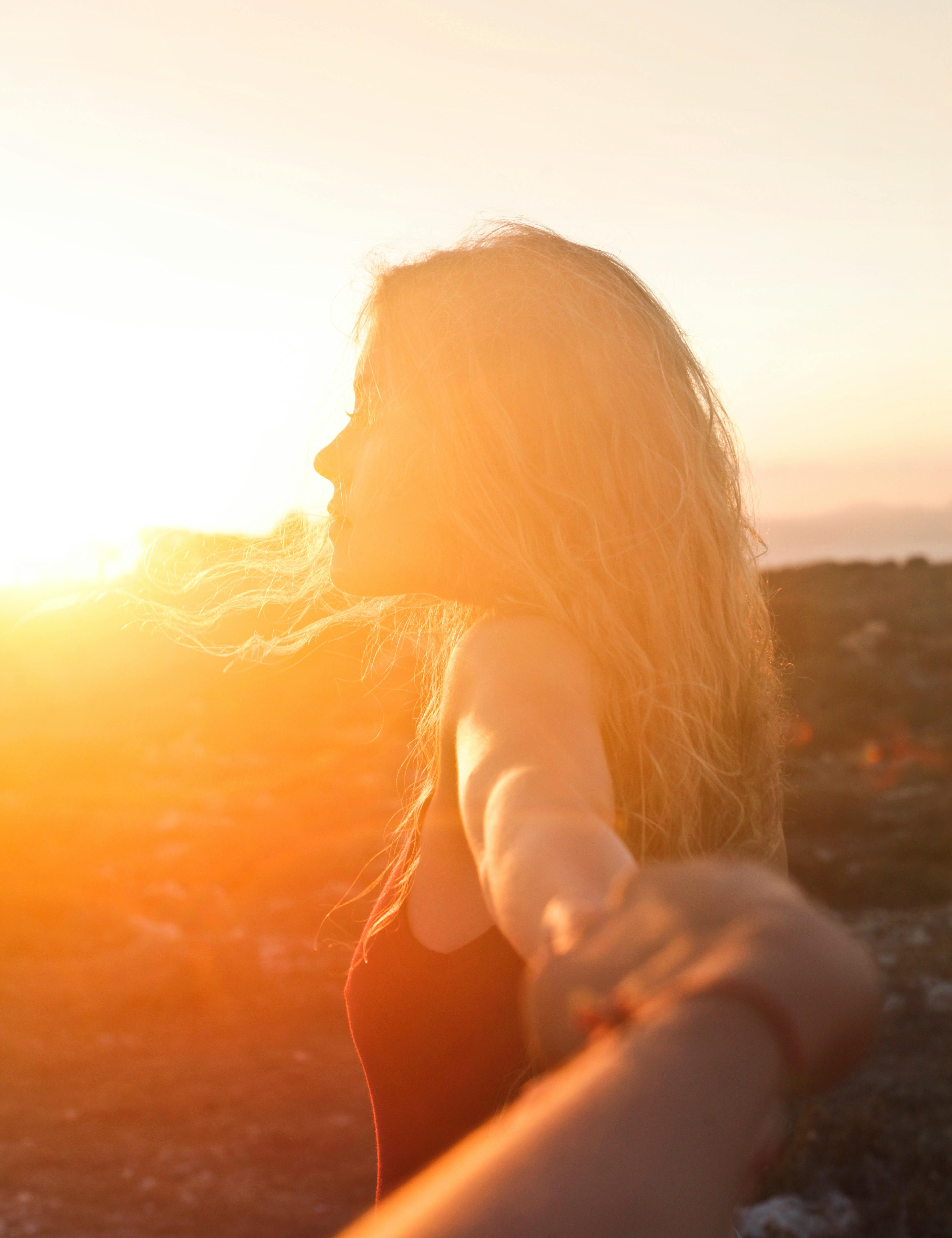 woman in the sun, sunset